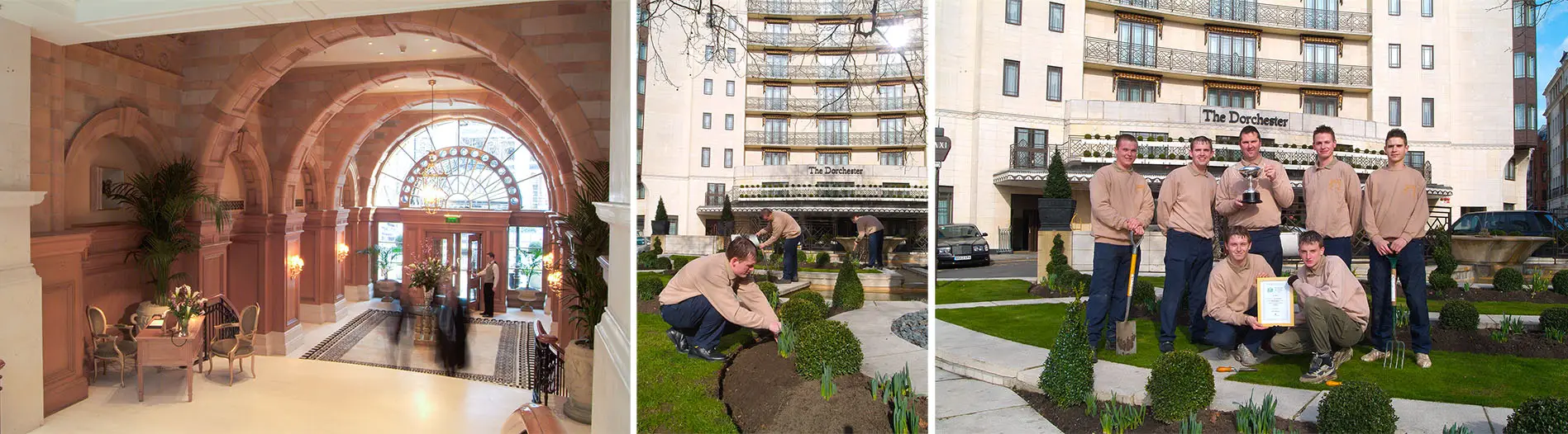 A professional commercial photograph of three gardeners in tan uniforms maintaining the landscaped flower beds in front of The Dorchester hotel in London. One gardener is in the foreground planting bulbs, while two others work on the garden behind him against the backdrop of the iconic hotel facade.