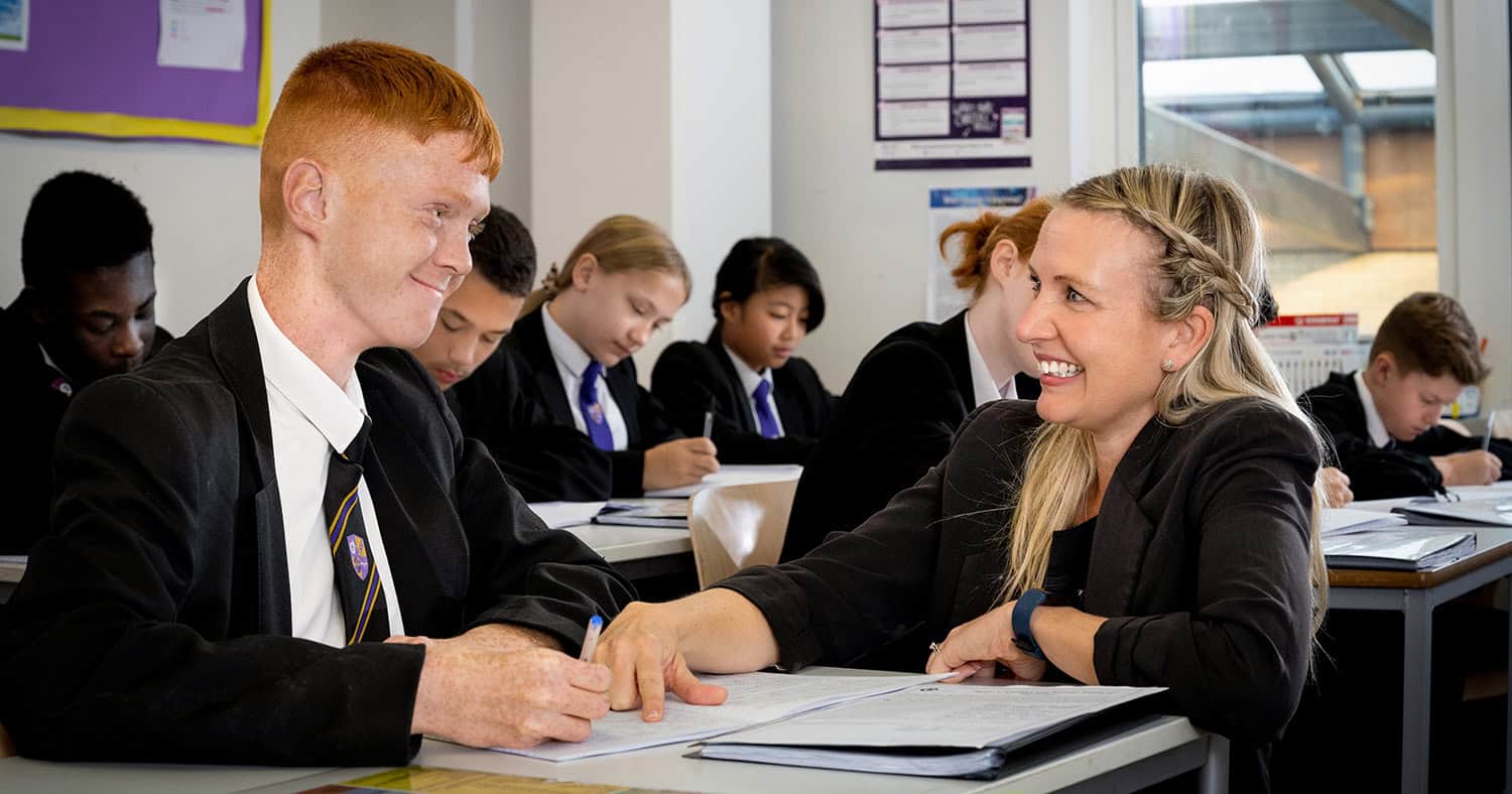 School prospectus student and tutor in a classroom.